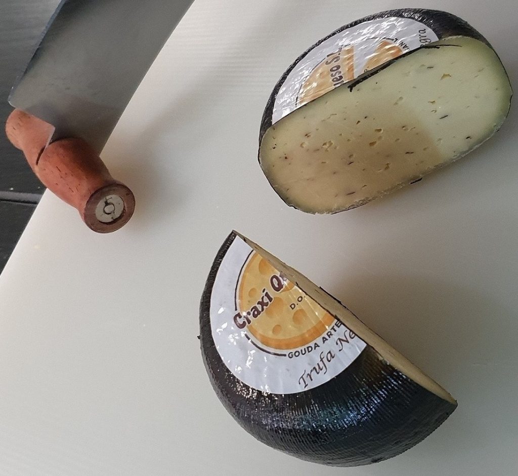 Whole cow cheese with black summer truffle. Artisan Gouda Cheese with truffle made with raw cow's milk with a Wheel Weight of ±0.50Kg Price €11.75