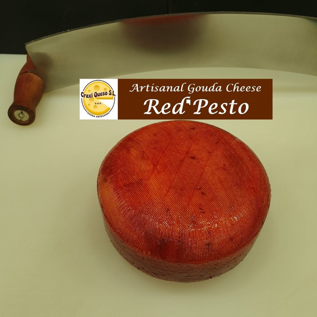 Dutch raw milk cow's cheese with red pesto. Artisan Gouda Cheese with pesto herbs with a cheese Wheel Weight of ±0.50 kg and Price of €9.60 per cheese