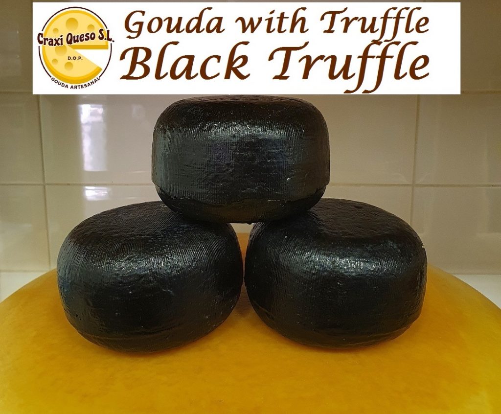 Whole cheese wheels with black truffle. Gouda cheese with truffle from raw cow's milk weight of the cheese wheel ±0.50Kg Price per cheese €11.75