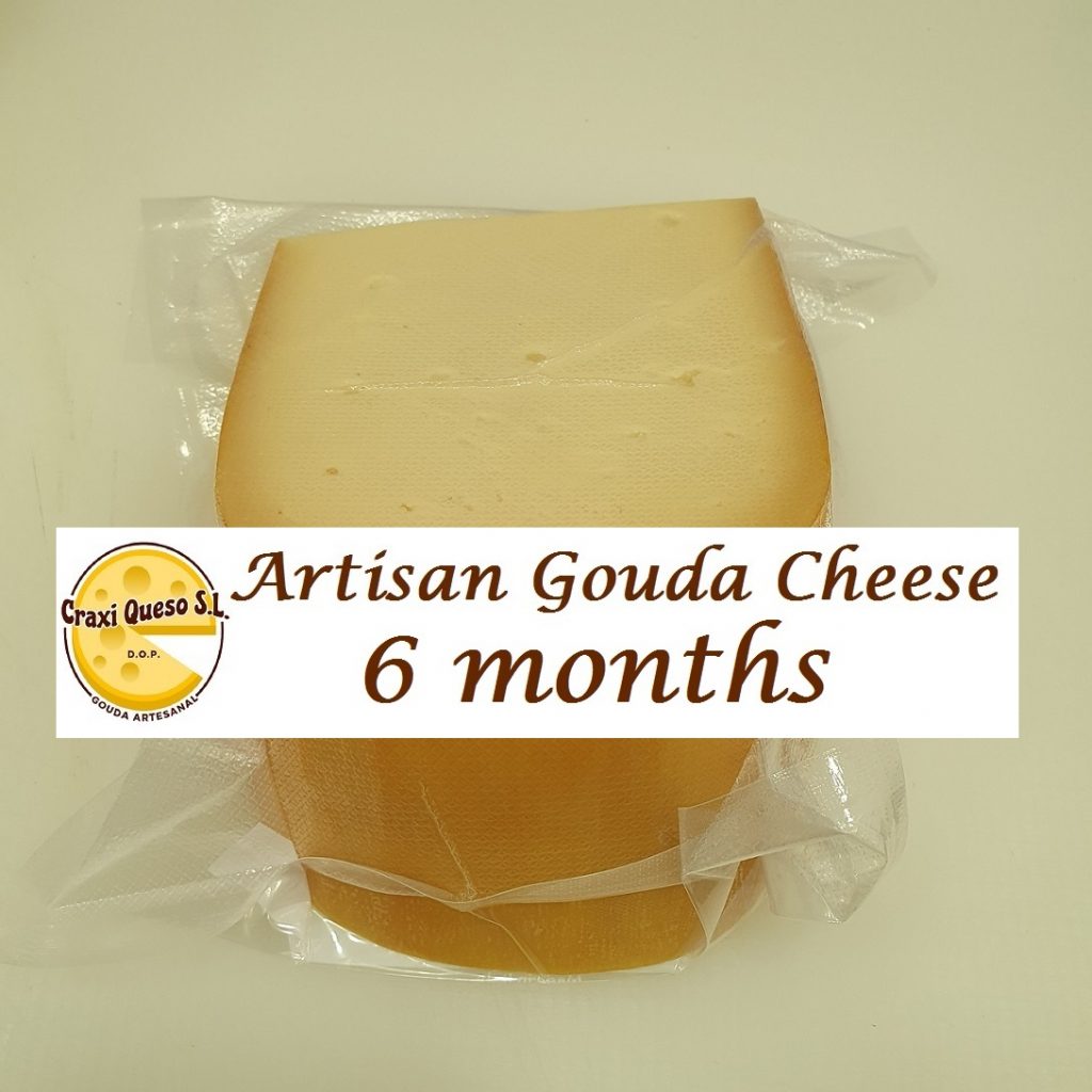 Freshly cut wedge and vacuum sealed artisan Craxi Gouda with a ripening period of 6 months