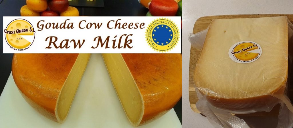 Large round artisan Gouda cheese, small round Gouda cheese, and freshly cut Gouda wedges