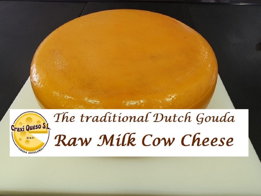 Round Gouda and Gouda Wedges. Dutch artisanal Gouda cheese for sale at Craxi Queso in Malaga, Spain